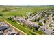 Stunning aerial view of a neighborhood highlighting a beautiful home with a lush green backyard at 9579 Bighorn Way, Littleton, CO 80125