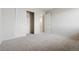 Spacious bedroom with carpet flooring and closet for ample storage at 9579 Bighorn Way, Littleton, CO 80125