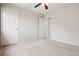 Bedroom with carpet floors and multiple doors leading to other rooms at 9579 Bighorn Way, Littleton, CO 80125