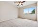 Bedroom with carpet floors, ceiling fan, and natural light from window at 9579 Bighorn Way, Littleton, CO 80125