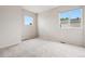 Bright bedroom featuring carpet, natural light, and neutral walls at 9579 Bighorn Way, Littleton, CO 80125