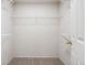 Walk-in closet with white wire shelving for storage, offering functionality and organization at 9579 Bighorn Way, Littleton, CO 80125