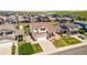 Charming two-story home with a well-manicured lawn and inviting front porch in a sunny neighborhood at 9579 Bighorn Way, Littleton, CO 80125