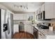 Modern kitchen with stainless steel appliances, granite countertops, and plenty of cabinet space at 9579 Bighorn Way, Littleton, CO 80125