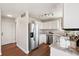Modern kitchen with stainless steel appliances, granite countertops, and ample cabinet space at 9579 Bighorn Way, Littleton, CO 80125