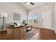 Light-filled living room with cathedral ceilings and access to the front porch through the front door at 9579 Bighorn Way, Littleton, CO 80125