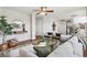Modern living room with hardwood floors, contemporary furnishings, and an open floor plan at 9579 Bighorn Way, Littleton, CO 80125