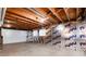 Unfinished basement with exposed beams and insulated walls at 3150 S Pitkin St, Aurora, CO 80013