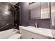 Modern bathroom featuring dark tiled shower and white vanity at 3150 S Pitkin St, Aurora, CO 80013