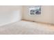 Neutral bedroom featuring carpet floors and a large window with neighborhood views at 3150 S Pitkin St, Aurora, CO 80013