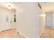 Bright entryway with tile flooring, white walls, a white front door, and a glimpse of a carpeted hallway at 3150 S Pitkin St, Aurora, CO 80013