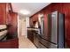 Well-lit kitchen featuring stainless steel appliances and dark countertops at 3150 S Pitkin St, Aurora, CO 80013