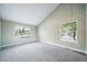 Bright bedroom with carpeted floors, large windows, and neutral wall color at 6398 S Emporia Cir, Englewood, CO 80111