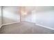 Bedroom with high ceilings, carpeted floors, and a large door at 6398 S Emporia Cir, Englewood, CO 80111