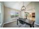 Open dining room offering modern light fixture with views to the kitchen and living room at 6398 S Emporia Cir, Englewood, CO 80111