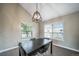 Stylish dining room featuring contemporary light fixture and natural light at 6398 S Emporia Cir, Englewood, CO 80111