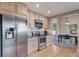 Spacious kitchen with stainless steel appliances, lots of storage and an adjacent dining area at 6398 S Emporia Cir, Englewood, CO 80111