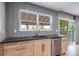Bright kitchen featuring a window over the sink and stainless steel appliances at 6398 S Emporia Cir, Englewood, CO 80111