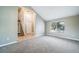 Inviting living room space with stairs, tall ceilings and neutral color palette at 6398 S Emporia Cir, Englewood, CO 80111