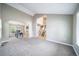 Spacious living room with neutral walls and flooring, open floorplan and bright natural light at 6398 S Emporia Cir, Englewood, CO 80111