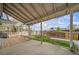 Covered patio with an attached wood deck and outdoor seating overlooking the fenced backyard at 6398 S Emporia Cir, Englewood, CO 80111