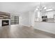 Open-concept living area featuring a fireplace, sliding glass doors, and updated kitchen with granite countertops at 14720 E Kentucky Dr # 622, Aurora, CO 80012