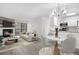 Bright, open-concept living and dining area with a fireplace and access to a balcony at 14720 E Kentucky Dr # 622, Aurora, CO 80012