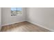 Bright bedroom with wood flooring, offering a cozy space with neighborhood view at 2171 Peralta Loop, Castle Rock, CO 80104