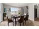 Elegant dining room featuring a stylish table, chairs, and a large window with scenic views at 2171 Peralta Loop, Castle Rock, CO 80104