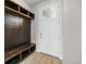 Mudroom with storage bench, coat hooks, and cubbies, conveniently located near the front door entrance at 2171 Peralta Loop, Castle Rock, CO 80104