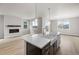 Open floor plan with the kitchen in the background with white countertops at 2171 Peralta Loop, Castle Rock, CO 80104