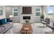 Inviting living room featuring a fireplace, plush rug, and modern decor, creating a cozy and stylish space at 2171 Peralta Loop, Castle Rock, CO 80104
