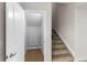 A look inside the storage under the stairs, featuring a carpeted floor and a door for crawlspace access at 2171 Peralta Loop, Castle Rock, CO 80104