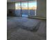 A large living room with carpet and sliding doors to the outside at 1085 N Lafayette St # 602, Denver, CO 80218