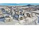 Aerial view of a residential neighborhood in a snowy landscape at 239 Rogers Ct, Castle Rock, CO 80104