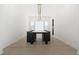 Modern dining room with long table and light wood floors at 239 Rogers Ct, Castle Rock, CO 80104