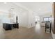 Modern dining room with a large table and light wood floors at 239 Rogers Ct, Castle Rock, CO 80104