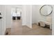 Light and airy entryway with a bench and mirror at 239 Rogers Ct, Castle Rock, CO 80104