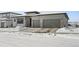 Modern two-story home with attached two-car garage and snow-covered driveway at 239 Rogers Ct, Castle Rock, CO 80104