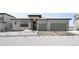 Modern two-story home with attached garage and snowy landscaping at 239 Rogers Ct, Castle Rock, CO 80104