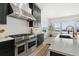 Modern kitchen with stainless steel appliances and white cabinetry at 239 Rogers Ct, Castle Rock, CO 80104