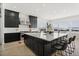 Modern kitchen with a large island and stunning views from the window at 239 Rogers Ct, Castle Rock, CO 80104