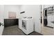 Laundry room with washer, dryer and built-in cabinets at 239 Rogers Ct, Castle Rock, CO 80104