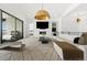 Bright living room with modern sectional sofa, fireplace and access to deck at 239 Rogers Ct, Castle Rock, CO 80104