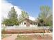 Charming home featuring a classic white picket fence and manicured front yard at 5040 Tennyson St, Denver, CO 80212