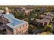 Extensive aerial view of the attractive real estate property, surrounded by mature trees and well-maintained grounds at 5242 Columbine Ln, Denver, CO 80221