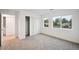 Bedroom featuring carpeted floors, closet with sliding doors and natural light at 5242 Columbine Ln, Denver, CO 80221