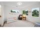 Comfortable bedroom featuring three large windows providing natural light at 5242 Columbine Ln, Denver, CO 80221