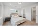 Comfortable bedroom featuring a window, closet, and ensuite bathroom at 5242 Columbine Ln, Denver, CO 80221