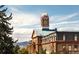 Beautiful exterior view featuring a historically designed building with unique architectural details and a charming tower at 5242 Columbine Ln, Denver, CO 80221